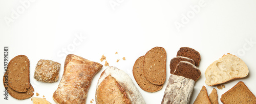 Different fresh baked bread on white background