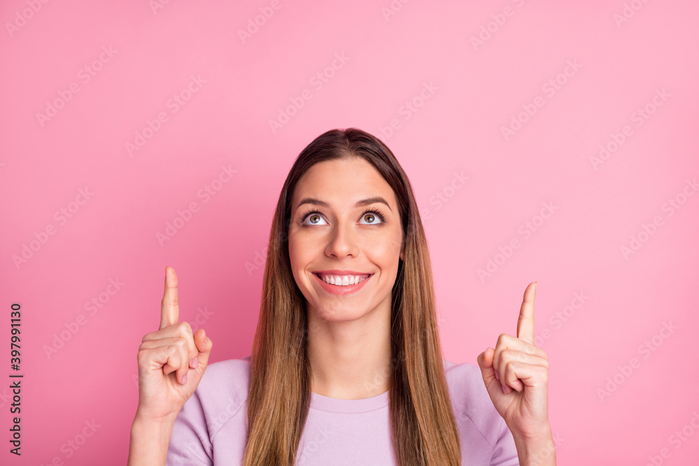 Close-up portrait of lovely content cheerful straight-haired girl showing up advert copy space isolated over pink color background Close-up portrait of lovely content cheerful straight-haired girl showing up advert copy space isolated over pink color background