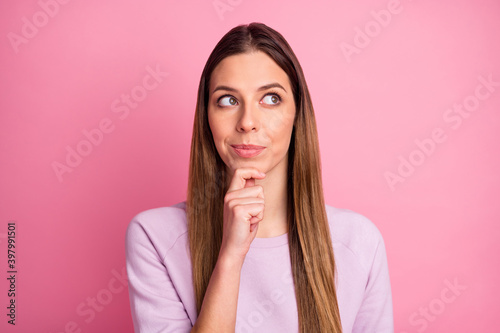 Close-up portrait of attractive curious minded straight-haired girl thinking creating strategy isolated over pink pastel color background