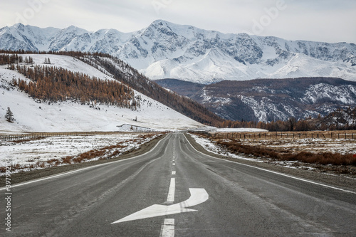 Road in snowy mountains in winter