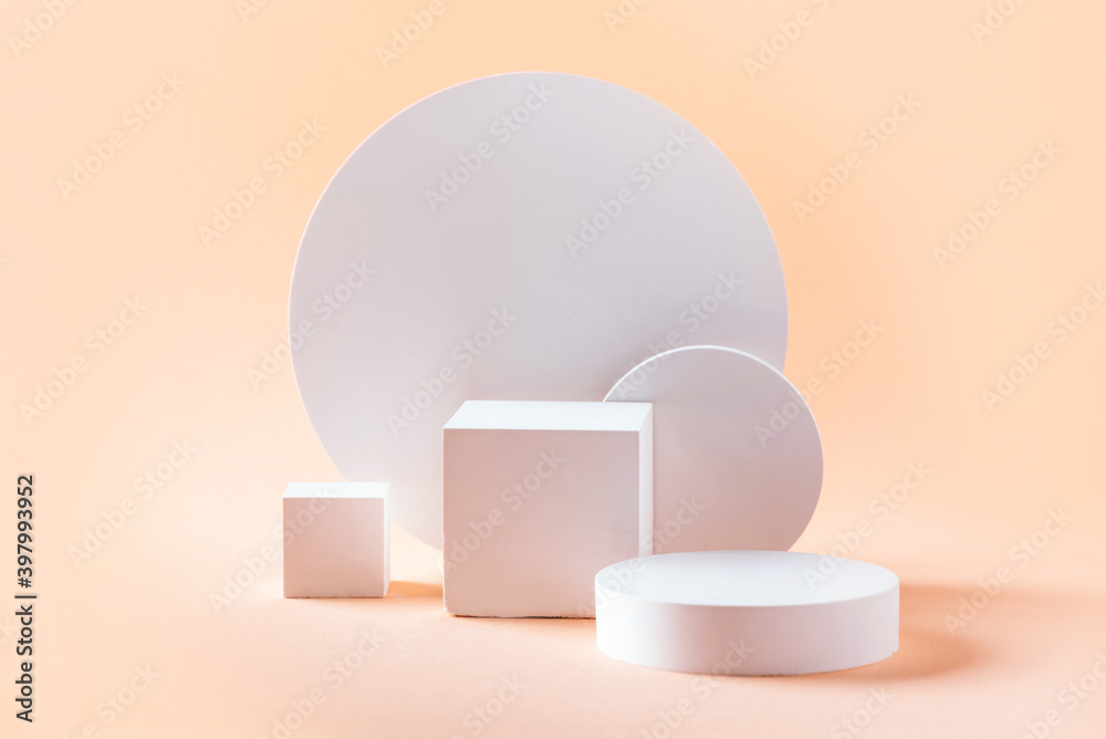 Abstract empty geometric shape podium for product on pastel beige background. Copy space. White cube on natural backdrop. Pedestal template for advertising. Trendy minimal concept. Mock up Abstract empty geometric shape podium for product on pastel beige background. Copy space. White cube on natural backdrop. Pedestal template for advertising. Trendy minimal concept. Mock up