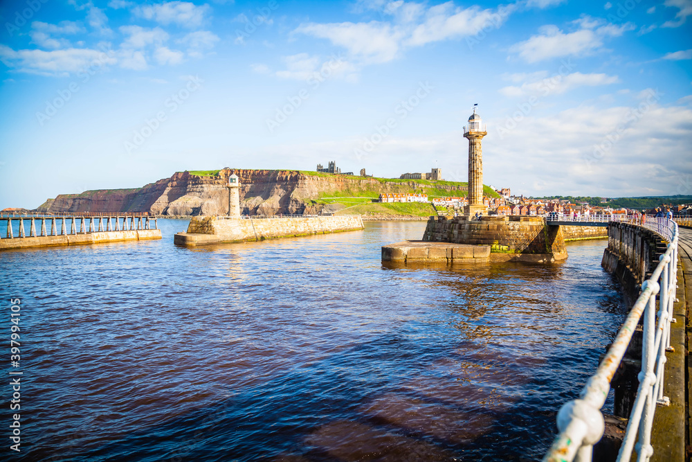 Fototapeta premium Pier and lighthouse of Whitby, Yorkshire, United Kingdom