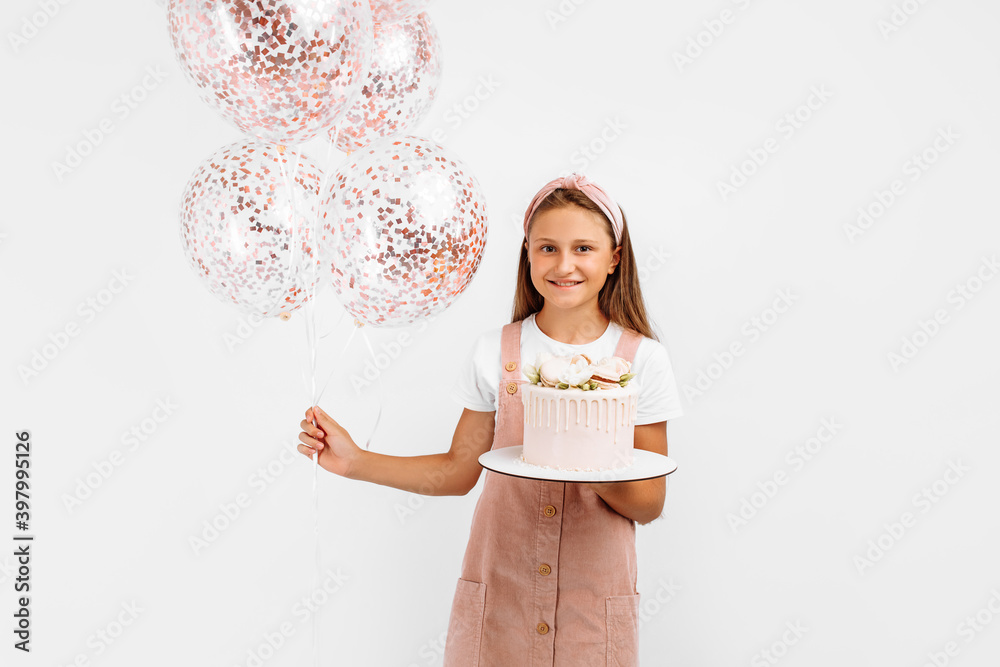 happy little girl holding a beautiful big birthday cake, birthday celebration with balloons, over white background happy little girl holding a beautiful big birthday cake, birthday celebration with balloons, over white background