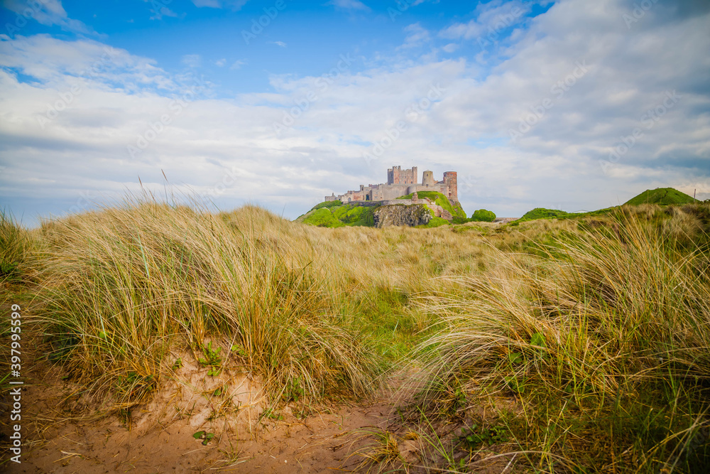 Bamburgh Castle on the beach of Northumberland,  United Kingdom