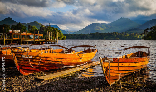 Leinwand Poster Rowing boats on the shore of Derwent water in Keswick,  Lake district,  Cumbria,