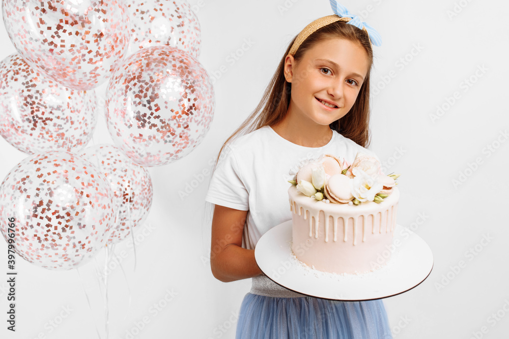 happy little girl holding a beautiful big birthday cake, birthday celebration with balloons, over isolated white background happy little girl holding a beautiful big birthday cake, birthday celebration with balloons, over isolated white background
