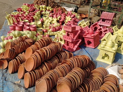 Kanpur, Uttar Pradesh/India- November 12 2020: Colorful clay pots and other toys created by the potter. Traditional handmade lamp used in Hindu festival of Diwali.