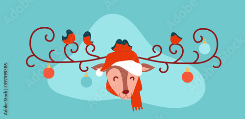 Bullfinches sit on curly deer antlers. Christmas merry deer in santa claus hat