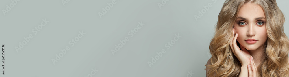 Young woman with healthy curly hair on white banner background Young woman with healthy curly hair on white banner background