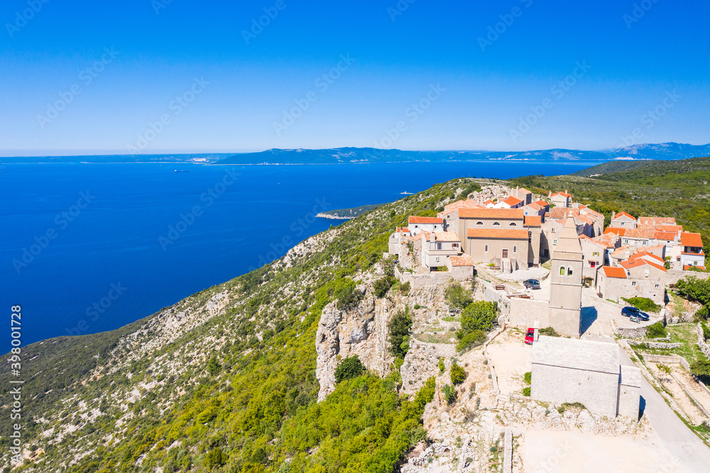 Aerial view of small town of Lubenice on the high cliff above the Adriatic sea, Cres island in Croatia