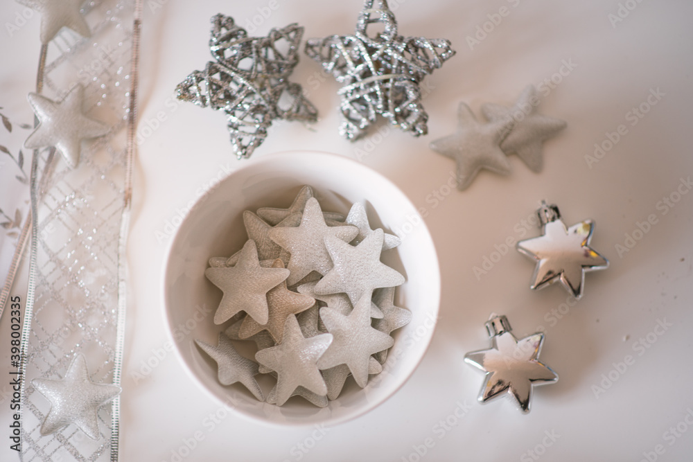 Christmas decoration on white background. Cozy silver blue christmas star and christmas ornaments. Christmas decoration on white background. Cozy silver blue christmas star and christmas ornaments.