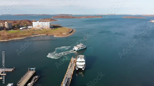 Wallpaper Mural Daytime drone view of a Ferry pulling away from dock in a suburban waterfront community. Torontodigital.ca