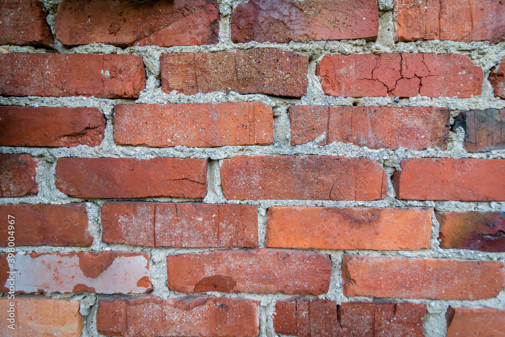 Old red wall made out of red bricks. Bricks are different hue form aging. Old red wall made out of red bricks. Bricks are different hue form aging.
