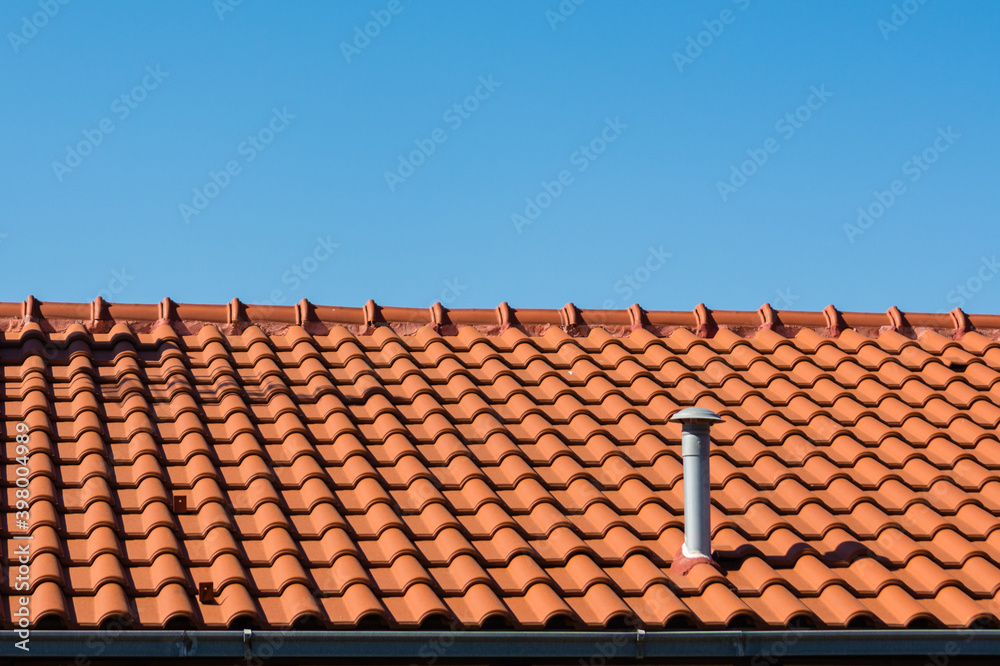 Shingles on rooftop with plastic ventilation pipe in Mediterranean. Shingles on rooftop with plastic ventilation pipe in Mediterranean.