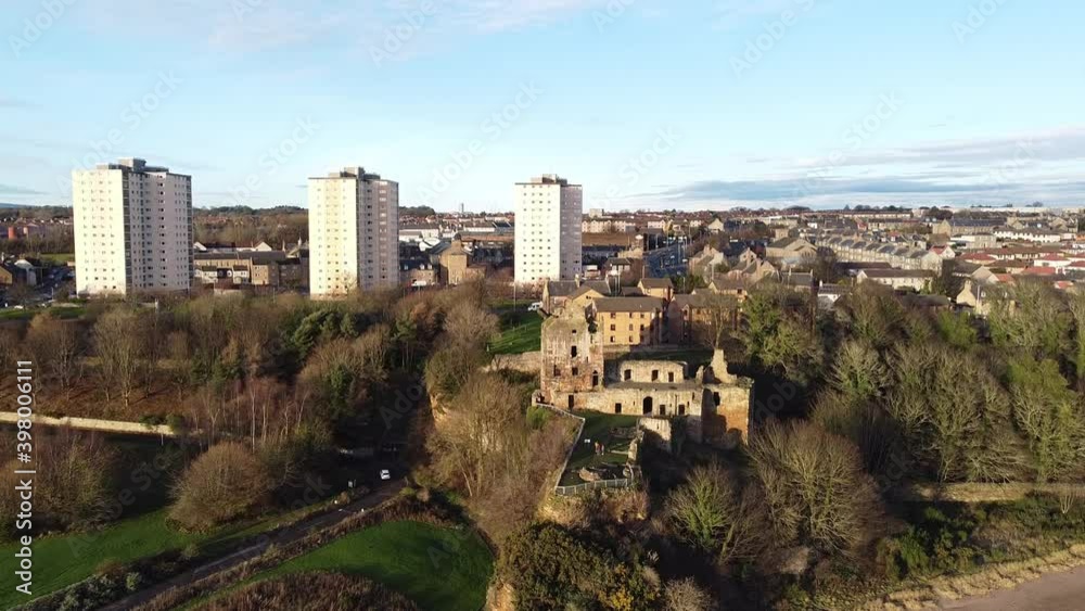 Aerial: Flight toward the cliff with medieval Ravenscraig Castle. Fife, Kirkcaldy, Scotland. Ravenscraig Castle is a ruined castle located in Kirkcaldy which dates from around 1460. Aerial: Flight toward the cliff with medieval Ravenscraig Castle. Fife, Kirkcaldy, Scotland. Ravenscraig Castle is a ruined castle located in Kirkcaldy which dates from around 1460.
