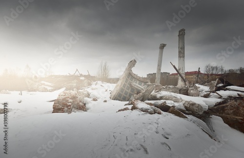 Dramatic sky with dark clouds above the ruins of an old building, Exterior details, columns close-up. Traditional Soviet architecture, past, history. Economic decline in Russia. Winter cityscape