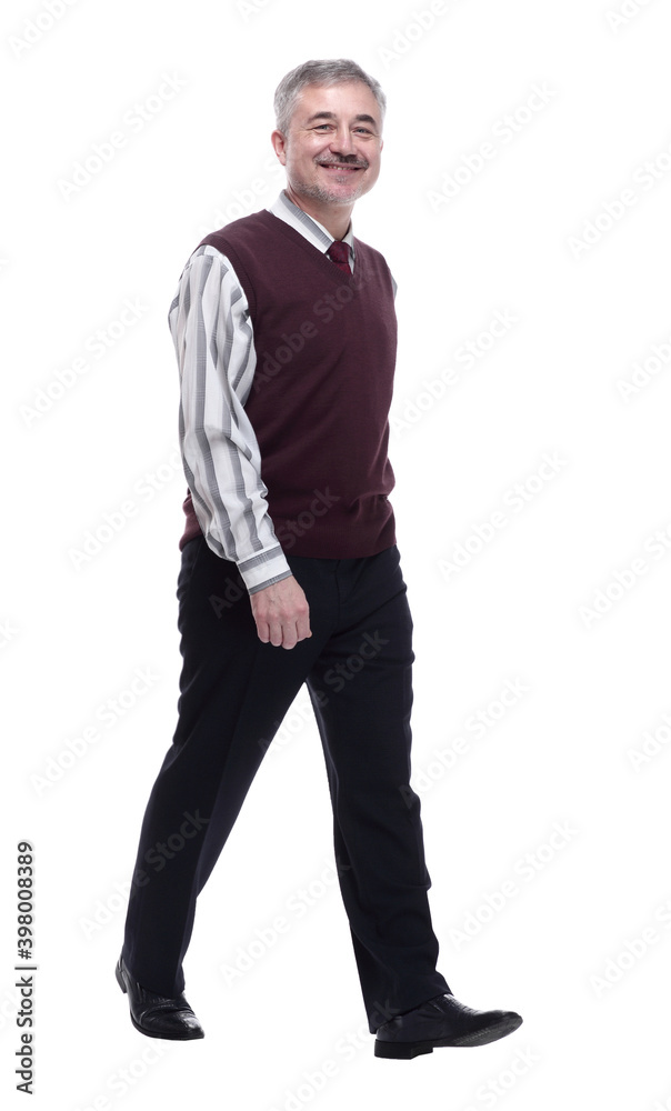 smiling mature man striding forward. isolated on a white smiling mature man striding forward. isolated on a white