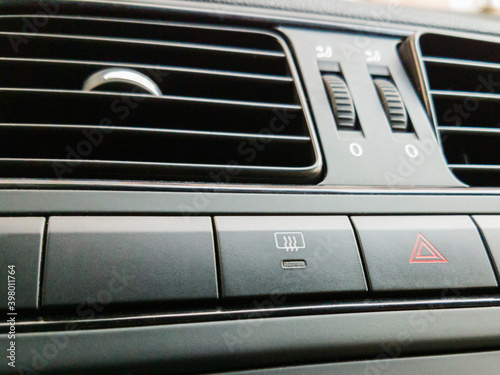 Car defrost button, switch in car interior © rostovdriver