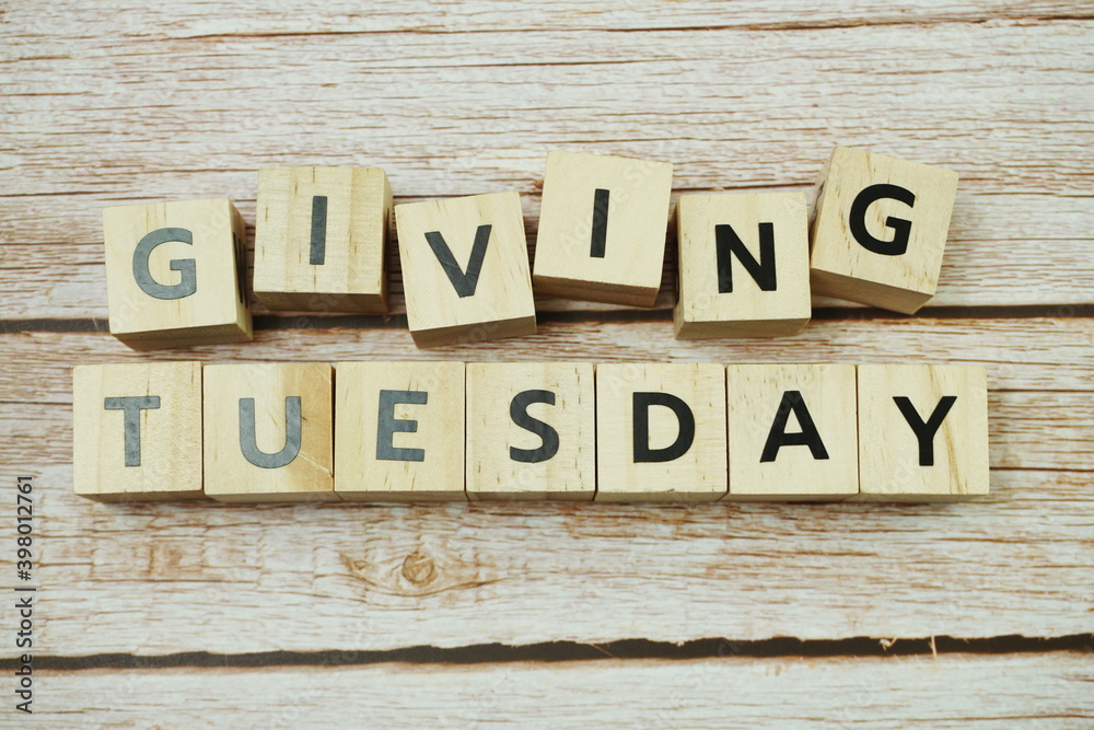 Giving Tuesday alphabet letter on wooden background Giving Tuesday alphabet letter on wooden background