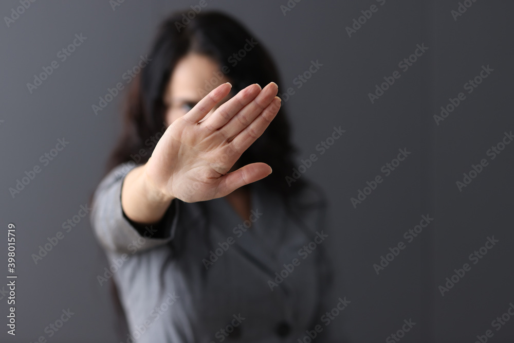 Woman shows negative gesture with her hand. Woman shows negative gesture with her hand.