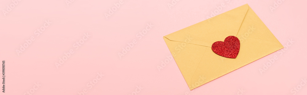 top view of red heart on envelope isolated on pink, banner top view of red heart on envelope isolated on pink, banner