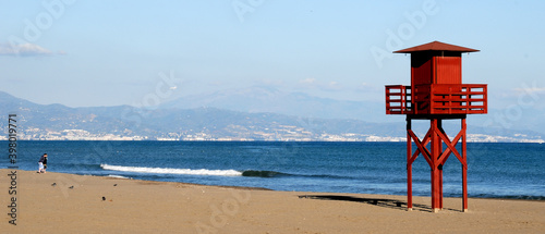 Typical red wooden watchtower for rescue workers on the beach of Torremolinos, Malaga - Spain  photo