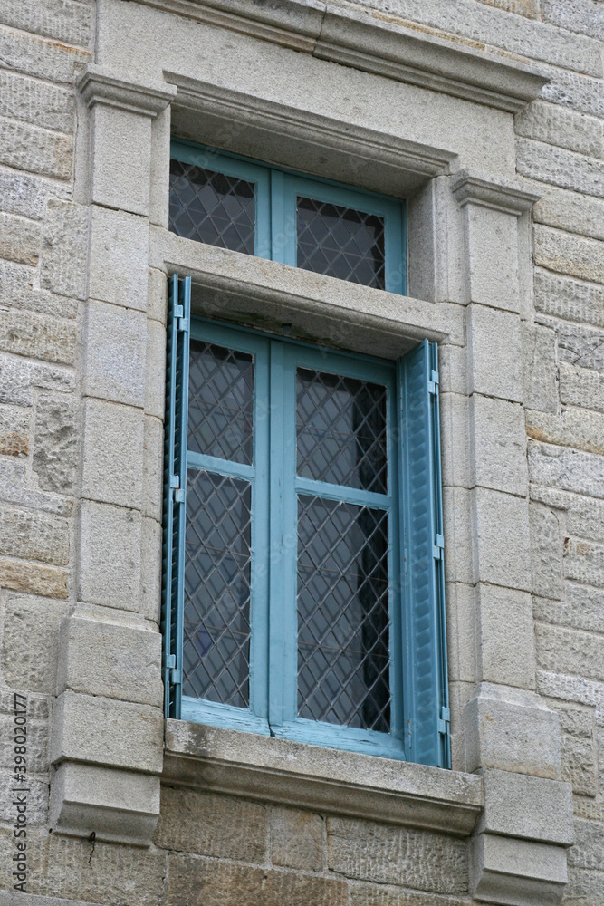 window in rochefort-en-terre in brittany (france)