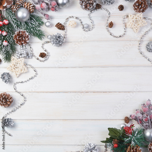 Сhristmas ball and fir cones decor on white wooden background. New Year theme. Top view