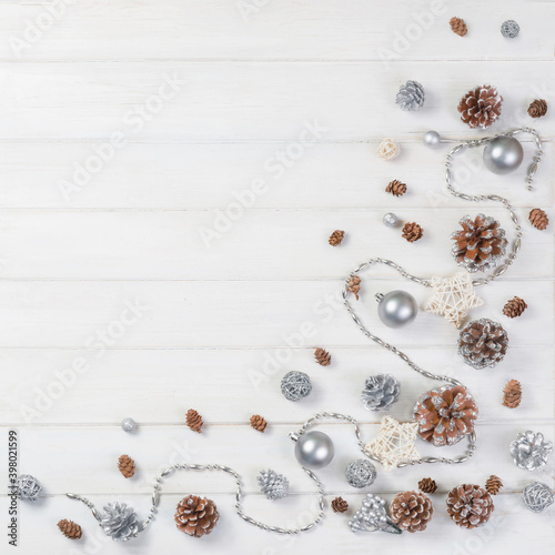 Сhristmas ball and fir cones decor on white wooden background. New Year theme. Top view