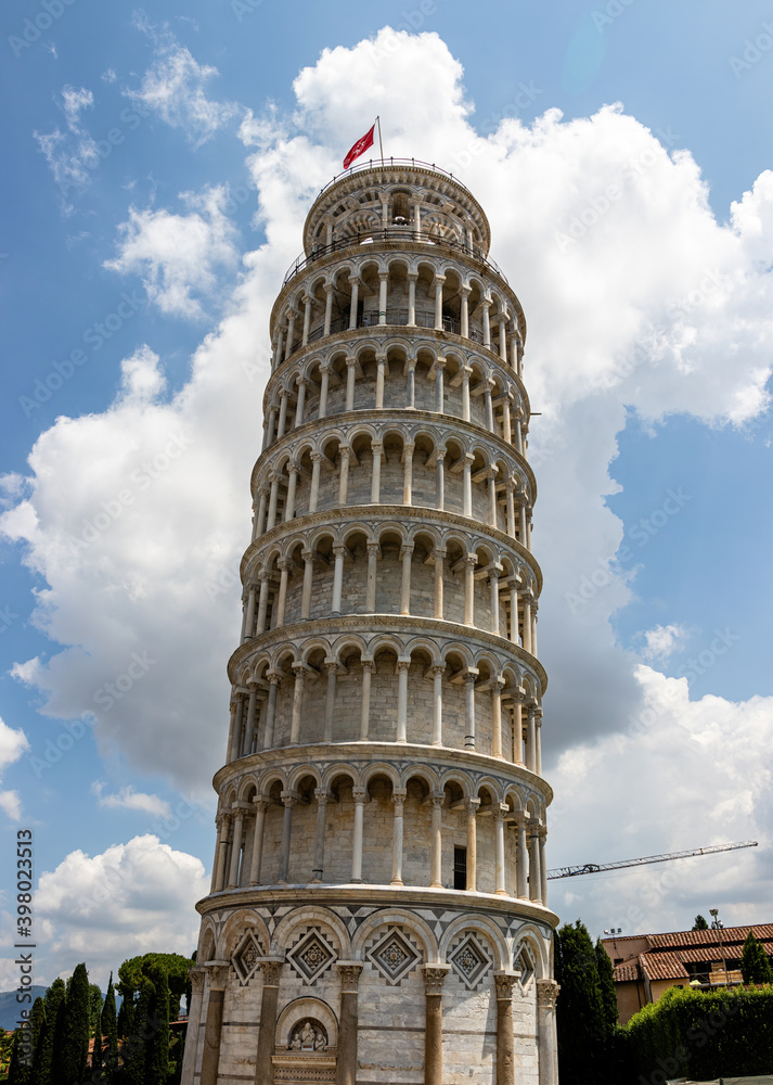 tower with a flag on top.leaning tower in Pisa without tourists. isolated leaning tower of pisa