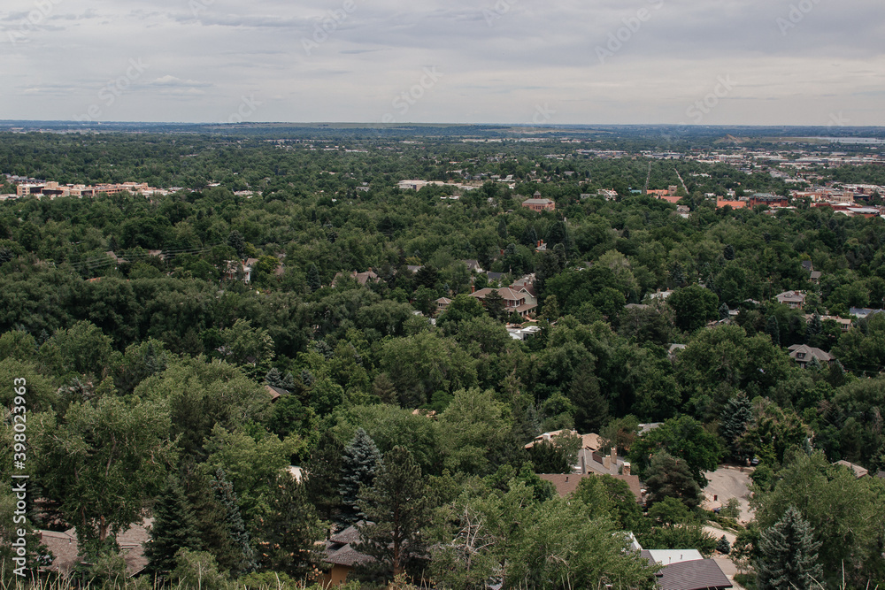 Scenic view of the city from large mountains on a cloudy summer day. Settlers park, Boulder, Colorado, USA. Denver