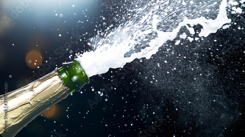 Detail of champagne wine splashing from bottle © Jag_cz