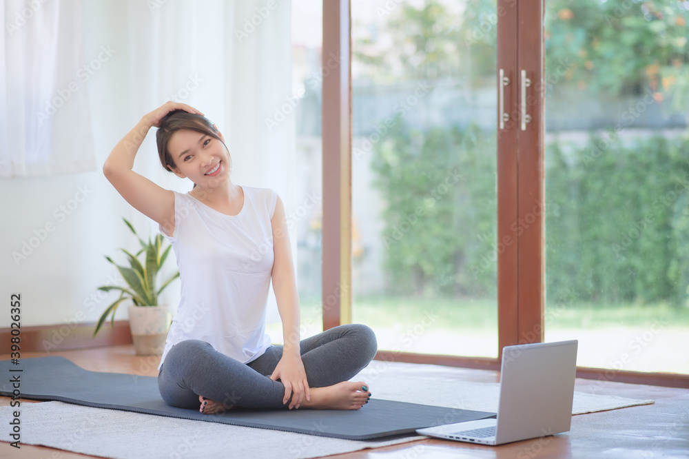 Beautiful asian woman staying fit by exercising at home for healthy trend lifestyle Beautiful asian woman staying fit by exercising at home for healthy trend lifestyle