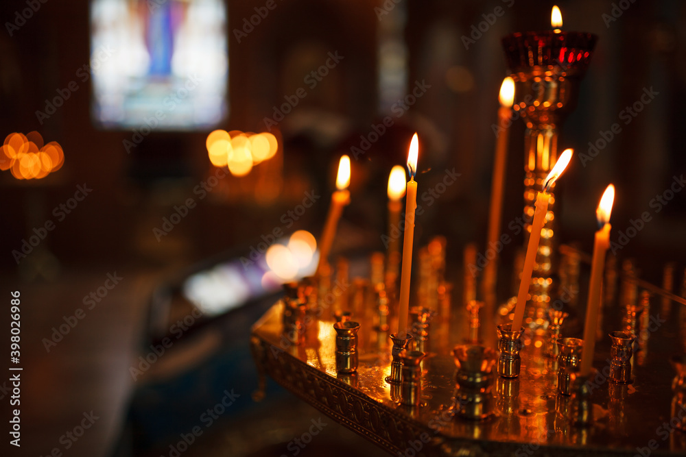 Lighted candles in the church.
