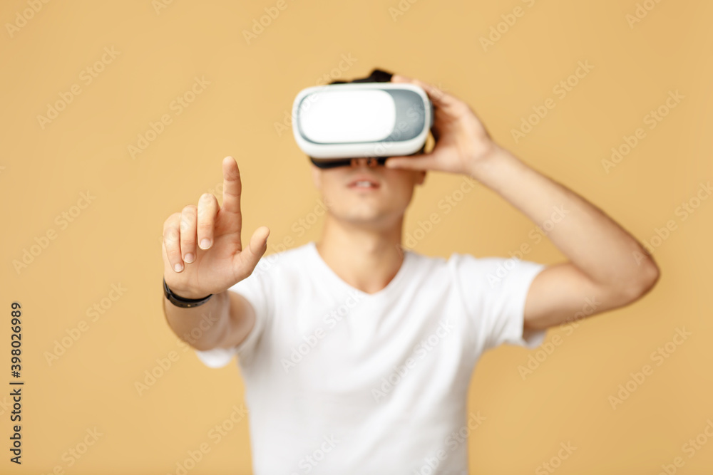 Man in vr glasses, watching 360 degree video with virtual reality headset