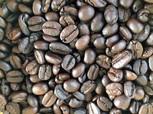 Roasted and dried coffee beans background.