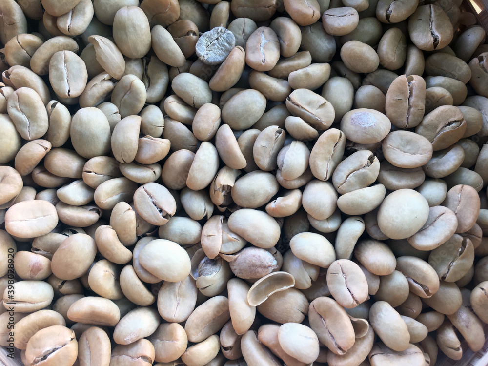 Roasted and dried coffee beans background.
