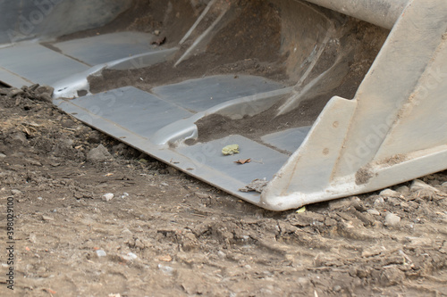 Excavator bucket at construction site.