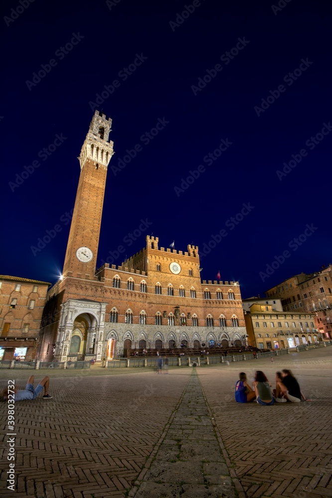 The Campo Square with Mangia Tower the landmark of Siena, Italy.