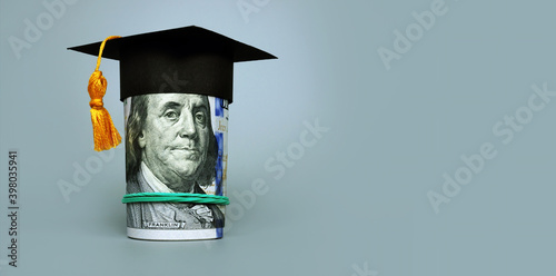 Quadro su tela Loan or savings for college. Graduation cap and roll of cash.