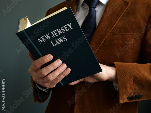 Man reads State New Jersey law about justice.