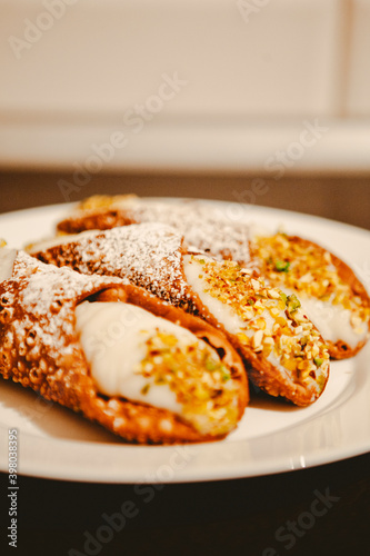 Cannoli are Italian pastries consisting of tube-shaped shells of fried pastry dough, filled with a sweet, creamy filling usually containing ricotta—a staple of Sicilian cuisine. Palermo, Sicily, Italy