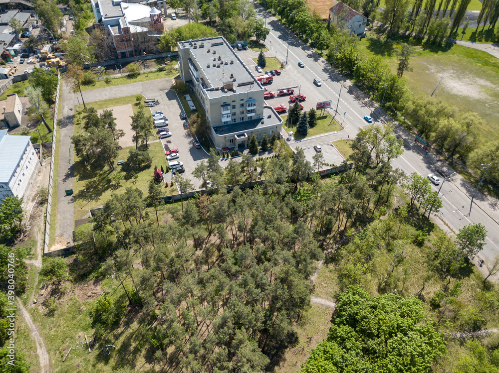 Aerial drone view. Pine forest on the outskirts of the city on a sunny day. Aerial drone view. Pine forest on the outskirts of the city on a sunny day.