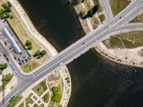 Aerial drone top view. Automobile bridge across the river.