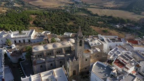 Views of Vejer de la Frontera seen from above. Aerial footage of church and white andalusian town