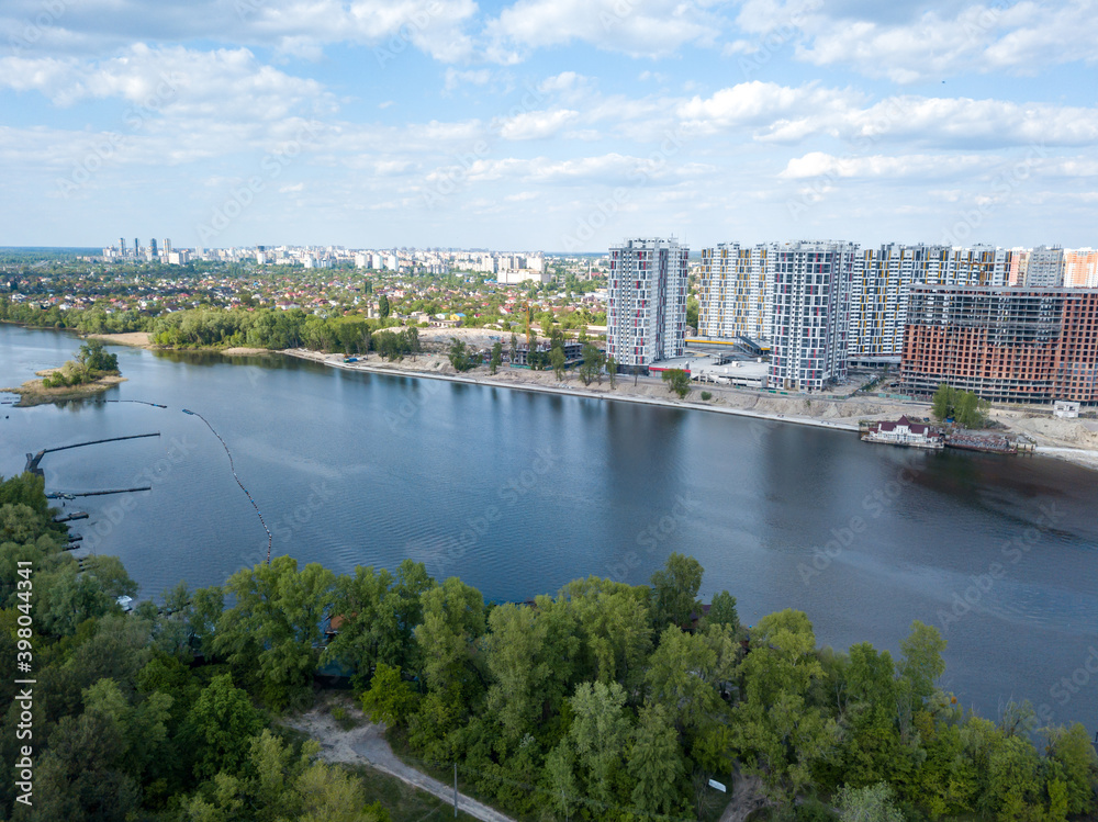 Aerial drone view. Dnieper river in Kiev on a sunny day.
