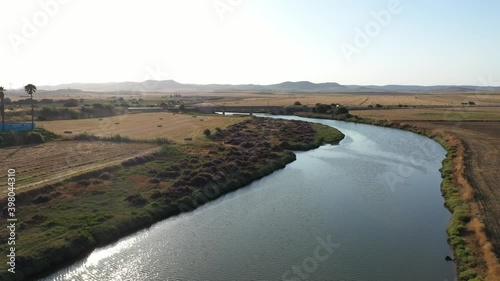 Aerial view of rural landscape of Andalusia coastside in Conil de la Frontera with Rio Salado flowing next to the farmland
