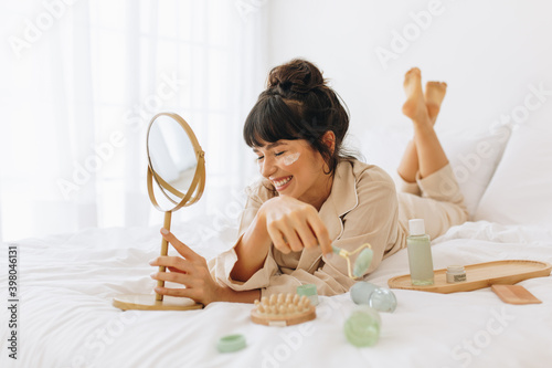 Vászonkép Woman enjoying skin care activity at home