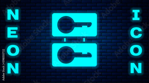 Glowing neon Metal mold plates for casting keys icon isolated on brick wall background. Set for mass production and forgery of the keys. Vector Illustration.