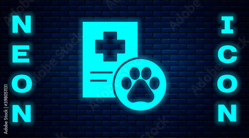 Glowing neon Clipboard with medical clinical record pet icon isolated on brick wall background. Health insurance form. Medical check marks report. Vector.